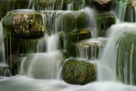Man made waterfall or cascade with silky waterの写真素材