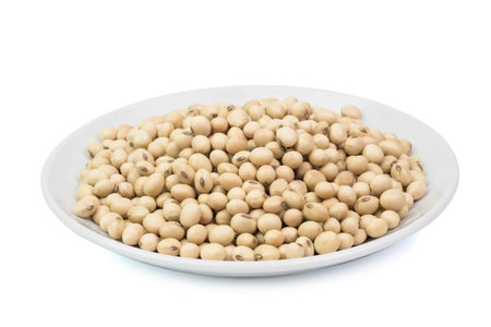 raw soybeans in dish isolated on white background, fresh soy protein for health.の写真素材