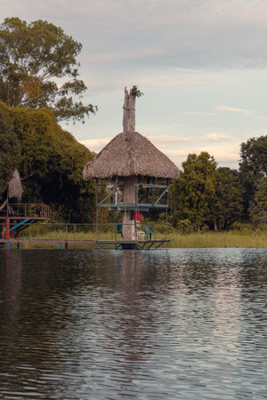 palm leaf house on the lakeの写真素材