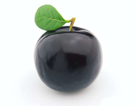 Sweet ripe prune with leavesの写真素材