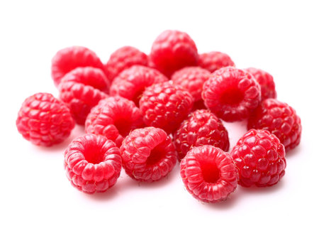 Ripe raspberry on a white background