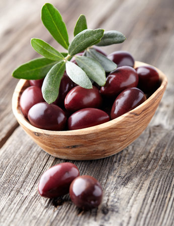 Calamata in a wooden backgroundの写真素材