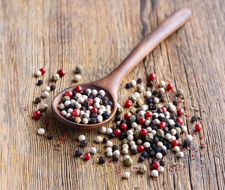 Pepper on a wooden background