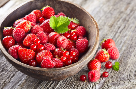 Wild berry on a wooden background
