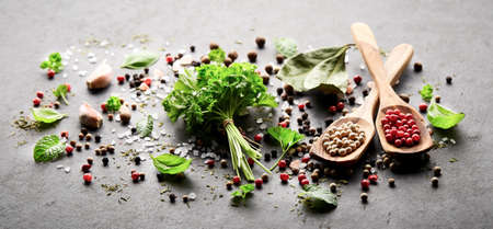 Herbs and spices  on a black boardの写真素材