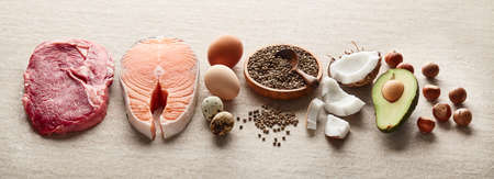 Healthy food for keto diet on sandy backgroundの写真素材