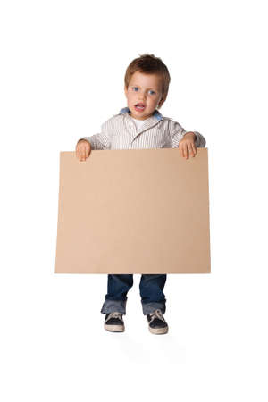 little boy holding a boardの写真素材