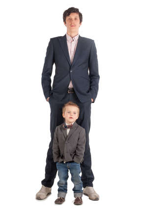 Man and little boy shake hands isolated on the whiteの写真素材