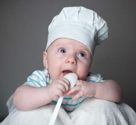 ittle boy in a chef hatの写真素材