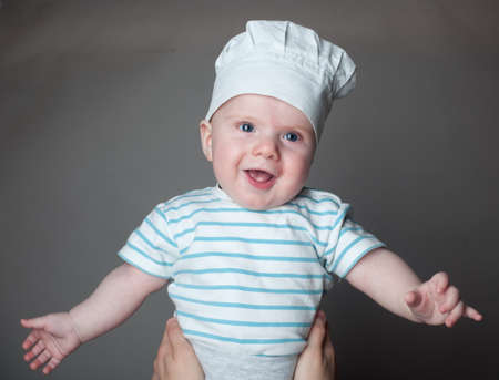 ittle boy in a chef hatの写真素材