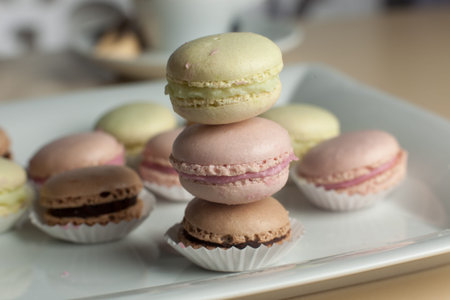 Coffee and macaroons on table close-up