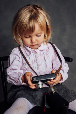Little girl in dress and hat photographsの写真素材