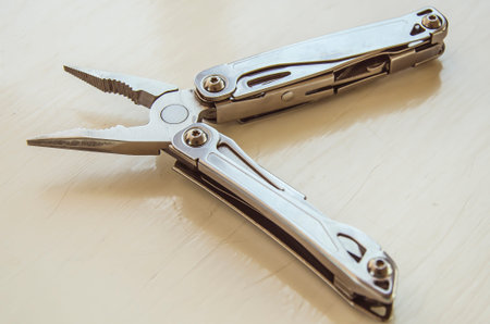 Multi tools knife on wooden backgroundの写真素材