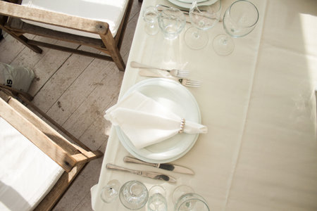 Place setting with plate knife and fork on table