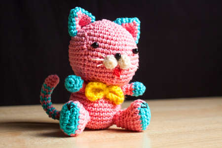 knitted handmade cat toy on the tableの写真素材