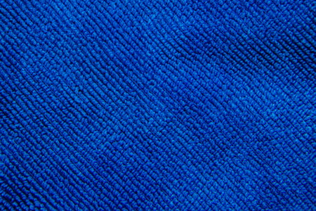 texture of a orange fabric background macro shotの写真素材