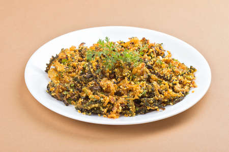 Indian Dish: Bitter gourd fry with spices and herbsの写真素材