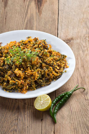 Indian Dish: Bitter gourd fry with spices and herbsの写真素材