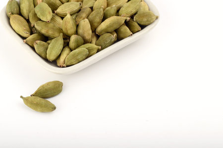Green Cardamom pods in plateの写真素材