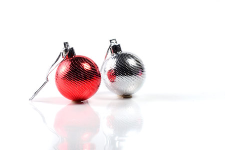 Christmas balls with ornaments on white background.の写真素材