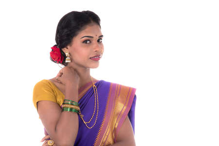 Beautiful Indian young girl posing in traditional Indian saree on white background.の写真素材