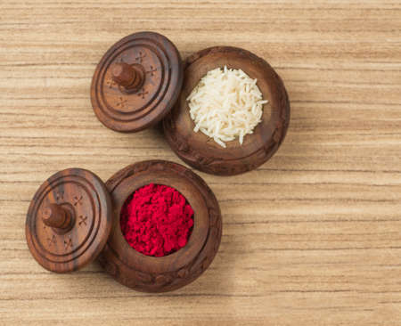 Indian festival: Raksha Bandhan background with an elegant Rakhi, Rice Grains and Kumkum. A traditional Indian wrist band which is a symbol of love between Brothers and Sisters.の写真素材