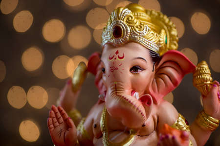 Hindu God Ganesha on Blured bokeh background, Ganesha Idol.の写真素材