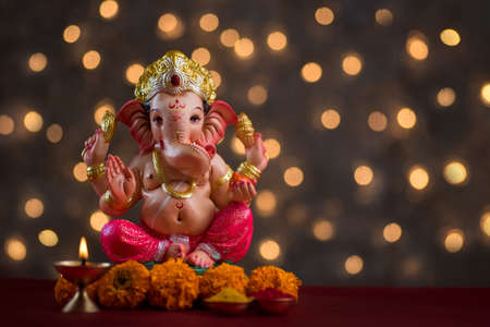 Hindu God Ganesha on Blured bokeh background, Ganesha Idol.の写真素材