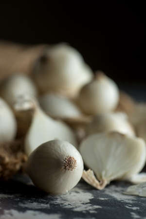 Onions on textured background. Food Ingredients.の写真素材