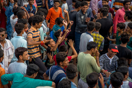 AMRAVATI, MAHARASHTRA, INDIA - 8 SEPTEMBER 2018: Crowd of young People enjoying and dancing in the "Govinda" at Dahi Handi festival to celebrate God Krishna's Birth.のeditorial素材