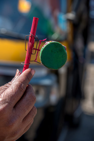 AMRAVATI, MAHARASHTRA, INDIA, JANUARY - 26, 2018: Unidentified street seller selling colorful...