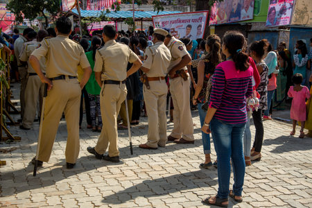 AMRAVATI, MAHARASHTRA, INDIA - 8 SEPTEMBER 2018: Crowd of young People enjoying and dancing in the...