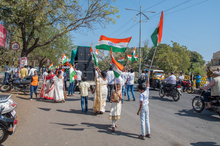 AMRAVATI, MAHARASHTRA, INDIA, JANUARY - 26, 2018: Unidentified people and student celebrating the Indian Republic Day by dancing with flags, drums.のeditorial素材
