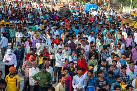 AMRAVATI, MAHARASHTRA, INDIA - 8 SEPTEMBER 2018: Crowd of young People enjoying and dancing in the "Govinda" at Dahi Handi festival to celebrate God Krishna's Birth.のeditorial素材