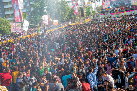 AMRAVATI, MAHARASHTRA, INDIA - 8 SEPTEMBER 2018: Crowd of young People enjoying and dancing in the "Govinda" at Dahi Handi festival to celebrate God Krishna's Birth.のeditorial素材