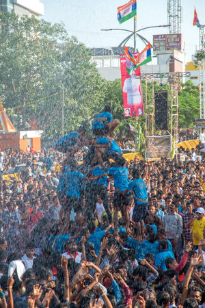 AMRAVATI, MAHARASHTRA, INDIA - 8 SEPTEMBER 2018: Crowd of young People enjoying and dancing in the...