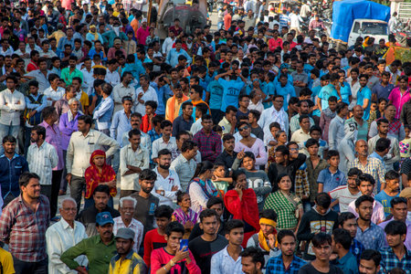 AMRAVATI, MAHARASHTRA, INDIA - 8 SEPTEMBER 2018: Crowd of young People enjoying and dancing in the "Govinda" at Dahi Handi festival to celebrate God Krishna's Birth.のeditorial素材