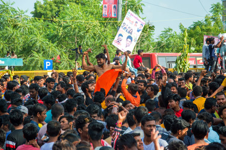 AMRAVATI, MAHARASHTRA, INDIA - 8 SEPTEMBER 2018: Crowd of young People enjoying and dancing in the...