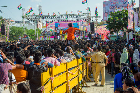AMRAVATI, MAHARASHTRA, INDIA - 8 SEPTEMBER 2018: Crowd of young People enjoying and dancing in the "Govinda" at Dahi Handi festival to celebrate God Krishna's Birth.のeditorial素材