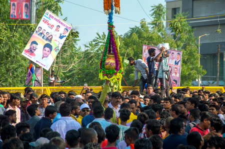 AMRAVATI, MAHARASHTRA, INDIA - 8 SEPTEMBER 2018: Crowd of young People enjoying and dancing in the...