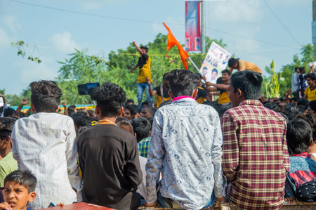 AMRAVATI, MAHARASHTRA, INDIA - 8 SEPTEMBER 2018: Crowd of young People enjoying and dancing in the "Govinda" at Dahi Handi festival to celebrate God Krishna's Birth.のeditorial素材
