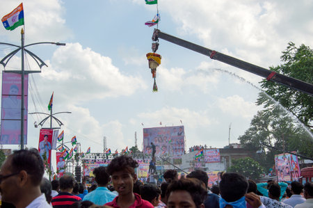 AMRAVATI, MAHARASHTRA, INDIA - 8 SEPTEMBER 2018: Crowd of young People enjoying and dancing in the "Govinda" at Dahi Handi festival to celebrate God Krishna's Birth.のeditorial素材