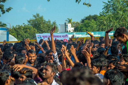 AMRAVATI, MAHARASHTRA, INDIA - 8 SEPTEMBER 2018: Crowd of young People enjoying and dancing in the "Govinda" at Dahi Handi festival to celebrate God Krishna's Birth.のeditorial素材