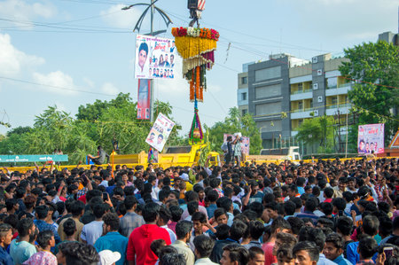 AMRAVATI, MAHARASHTRA, INDIA - 8 SEPTEMBER 2018: Crowd of young People enjoying and dancing in the "Govinda" at Dahi Handi festival to celebrate God Krishna's Birth.のeditorial素材