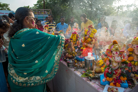 AMRAVATI, MAHARASHTRA, INDIA - 23 SEPTEMBER 2018: Unidentified faithful people perform pray of Hindu...