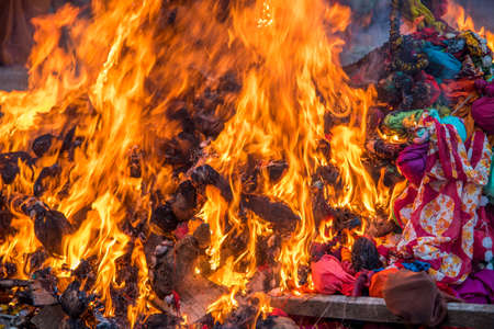 Celebrating Holika Dahan by worshiping and setting fire of wood logs or coconut. also known as the festival of colors Holi or the festival of sharing.の写真素材