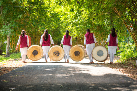 AMRAVATI, MAHARASHTRA, INDIA - SEPTEMBER 24: Unidentified group of young people celebrating Festival in park by playing drums with music.のeditorial素材