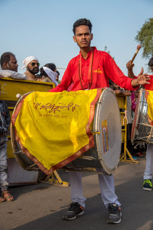 AMRAVATI, MAHARASHTRA, INDIA - 27 SEPTEMBER 2018: Unidentified faithful people carrying Hindu God...