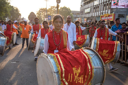 AMRAVATI, MAHARASHTRA, INDIA - 27 SEPTEMBER 2018: Unidentified faithful people carrying Hindu God...
