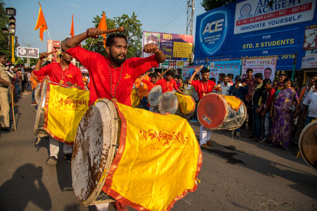 AMRAVATI, MAHARASHTRA, INDIA - 27 SEPTEMBER 2018: Unidentified faithful people carrying Hindu God...